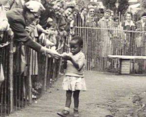 Congolese girl being fed at an enclosure of one of the last Human Zoos in Europe. Brussels, 1958.
